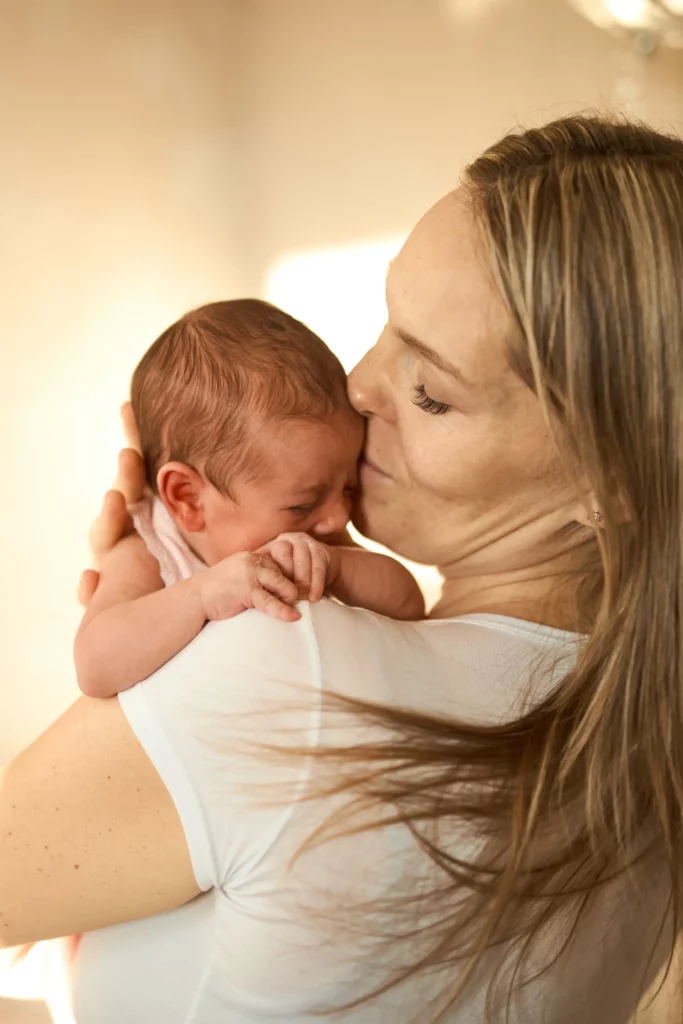 close up of happy young mother holding newborn bab 2023 11 27 05 17 37 utc